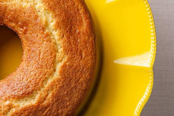 istock Homemade orange cake in a beautiful yellow cake holder 1309783108