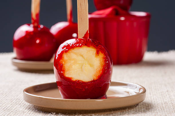 istock Love Apple. Red caramel covered apple dessert 1309783109