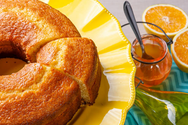 istock Homemade orange cake in a beautiful yellow cake holder 1309783236