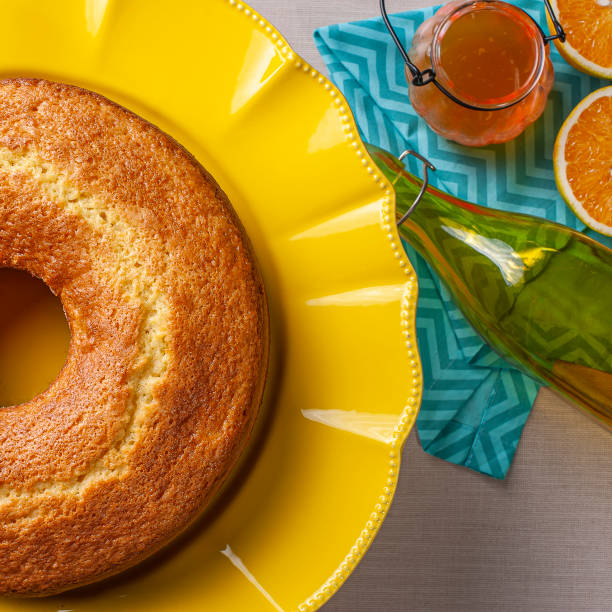Homemade orange cake in a beautiful yellow cake holder