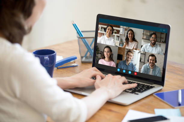 istock Happy millennial mixed race friends communicating by video call. 1309784467