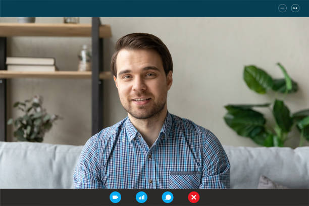 istock Handsome young happy man holding video call conversation. 1309784476