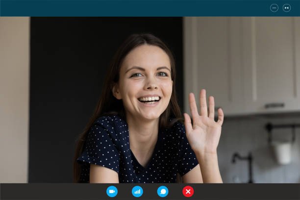 istock Millennial beautiful woman making hello gesture starting online conversation. 1309784503