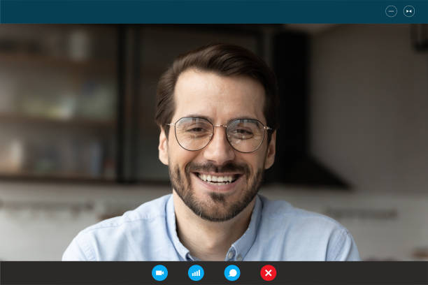istock Happy 30s man in eyeglasses holding video call funny talk. 1309784510