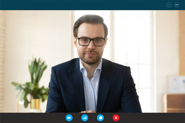 istock Handsome happy 30s confident businessman holding web camera call. 1309784523