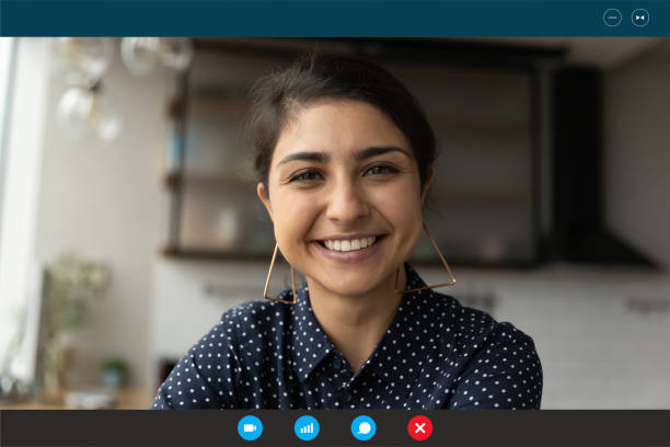 istock Smiling beautiful indian mixed race woman looking at web camera. 1309784553
