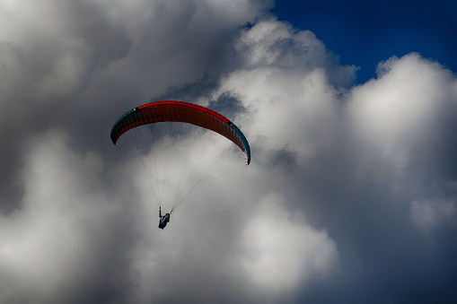 paraglider in dramatic sky