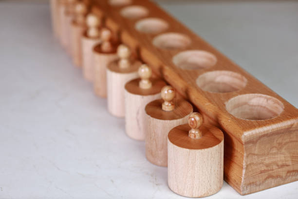 istock montessori sensorics cylinder block low to high and color blue box with cylinders 1309787950