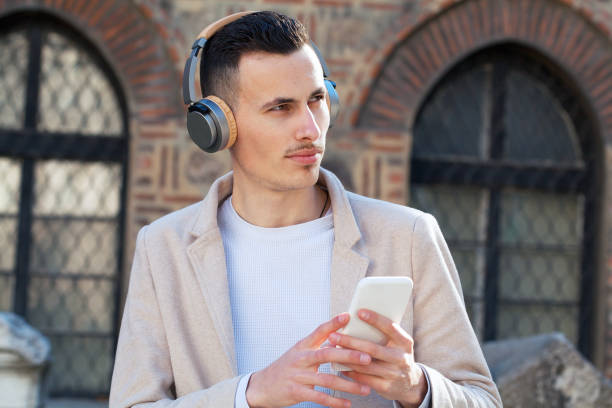 istock Young man listening to music 1309788730