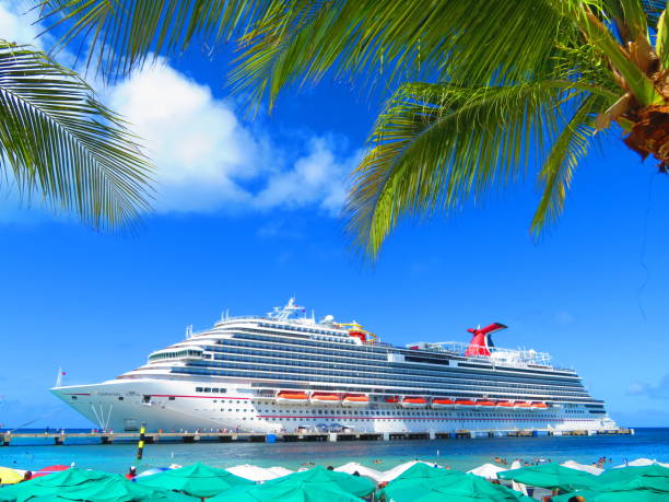 Miami, United States - November 19, 2016: A large passenger cruise ship, the Carnival Glory, turns around in Biscayne Bay as it prepares to exit the downtown Port of Miami via Government Cut.