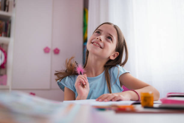 istock Adorable girl contemplating and smiling 1309789821