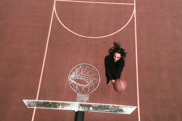 istock Basketball Player Practices on Outdoor Court 1309791870