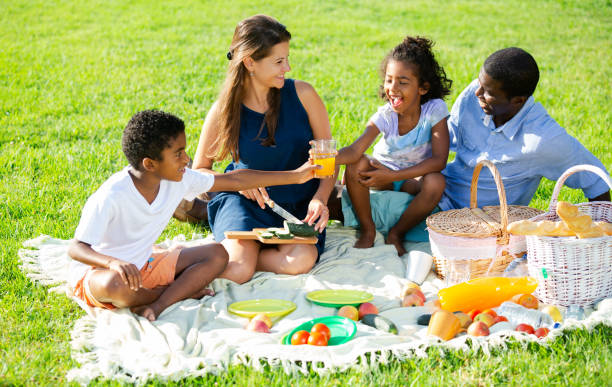 istock Couple with children at picnic 1309792776