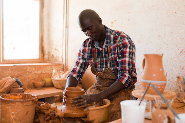 Man making ceramics on pottery wheel