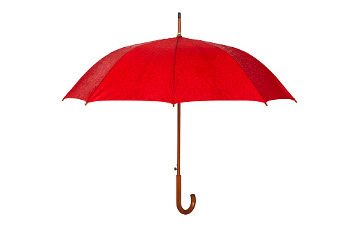 Patternless red colored rain umbrella isolated on white background. Side view.