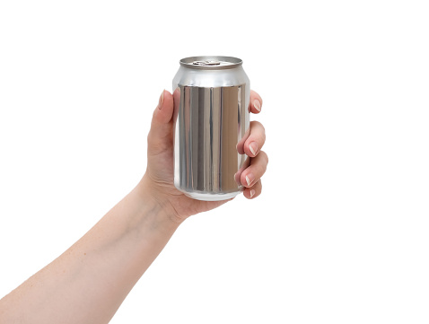 A woman's hand holds an aluminum can.