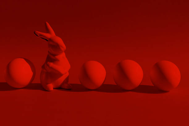 lapin en porcelaine avec quatre oeufs. rouge sur rouge, couleurs tendance du printemps à 2021. - figurine easter egg easter holiday photos et images de collection