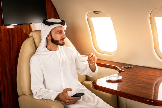 istock Arabian man wearing kandora flying on private jet 1309795786