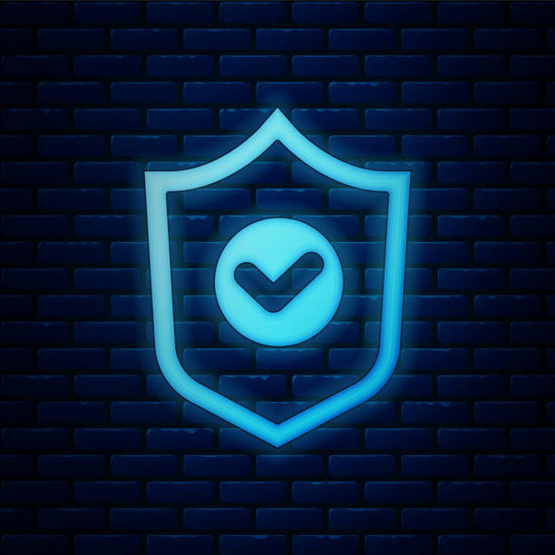 istock Glowing neon Shield with check mark icon isolated on brick wall background. Protection symbol. Security check Icon. Tick mark approved icon. Vector 1309796388