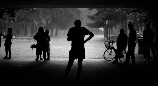 istock Silhouette of people during Thunderstorm 1309797405