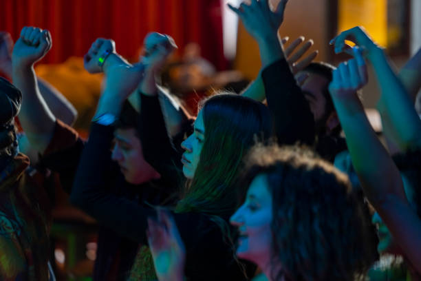 Young people having fun in at a concerts