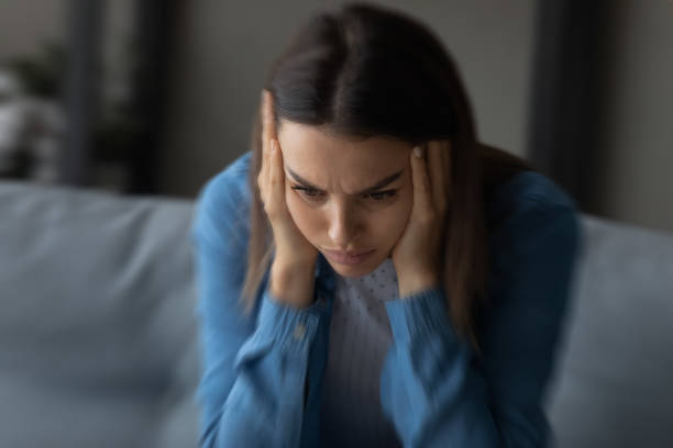 close up unhappy woman suffering from strong headache and dizziness - mental health depression illness healthy lifestyle imagens e fotografias de stock