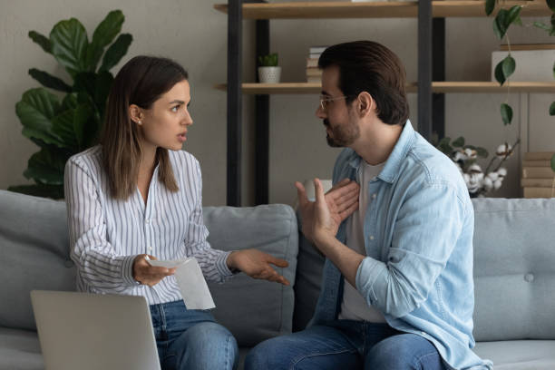 istock Angry wife and husband arguing about unexpected debt or expenses 1309798068