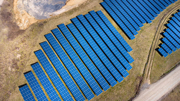 istock Solar panels - solar power plant - aerial view 1309798619