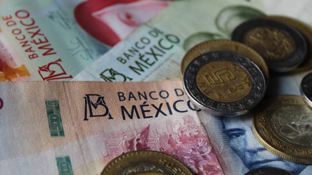 economy and finance with mexican money approach to mexican banknotes and coins mexican currency stock pictures, royalty-free photos & images