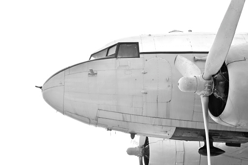 a black and white propeller aircraft front view and its engine