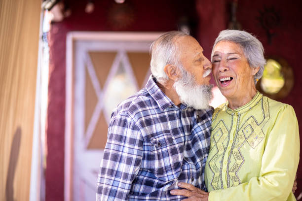 Senior Mexican Couple Romance A cute senior Mexican couple sharing a romantic moment at home. real wife stories stock pictures, royalty-free photos & images