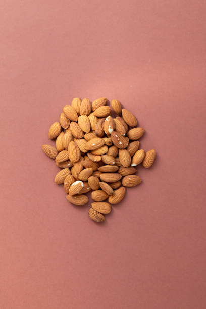 istock Group of nuts on brown background 1309804122