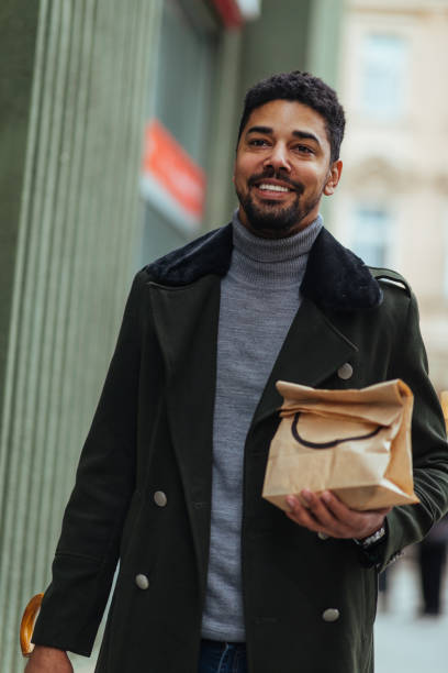 istock Afro male take his lunch to go 1309807536