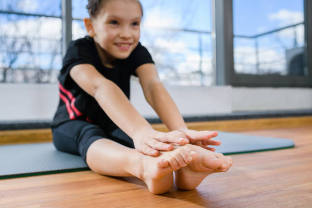 istock Close up girl hands and toes stretching 1309807908