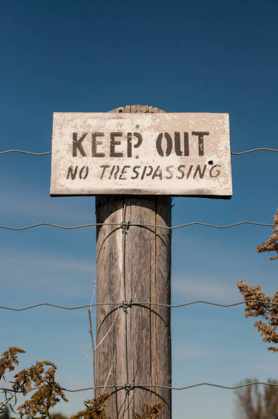 istock A faded warning sign reading Keep Out - No Trespassing 1309808186