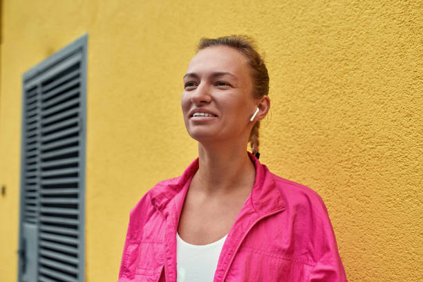 istock Young girl wearing wireless earbuds 1309808219