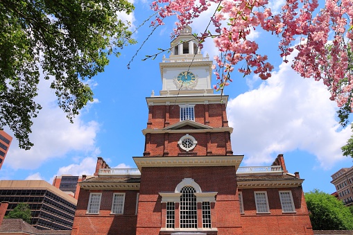 Philadelphia, Pennsylvania in the United States. Independence Hall building, old landmark. Georgian architecture. Spring time cherry blossoms.