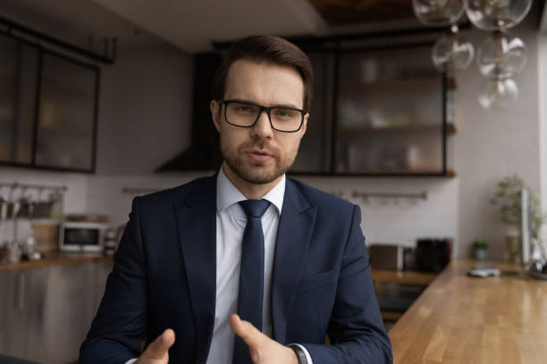 head shot portrait confident businessman wearing glasses speaking at camera - close up businessman corporate business side view imagens e fotografias de stock