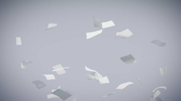 Flying sheets of white paper swirling in the air in a whirlwind stock photo