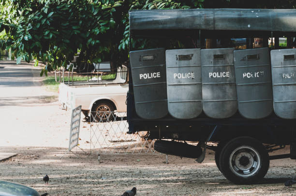 Riot police shields in Yangon, Myanmar Riot police shields hangfrom a truck parked outside the Shwedagon Pagoda in Yangon, Myanmar myanmar photos stock pictures, royalty-free photos & images
