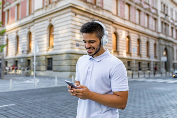 istock Happy young man on the street 1309818494