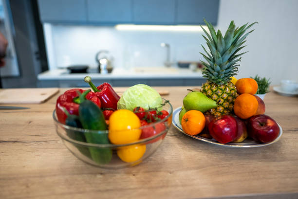 istock Fruits And Vegetables On The Table Of Modern Kitchen 1309820137