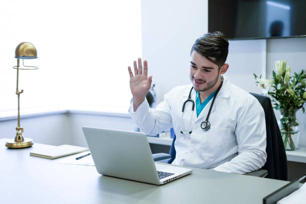 istock Latino ethnic doctor teleworking from his office during Covid-19. 1309821703