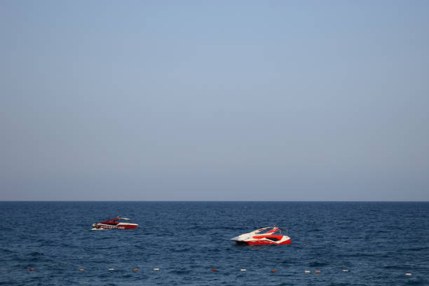 istock Two motor boats on the sea waves. 1309822074