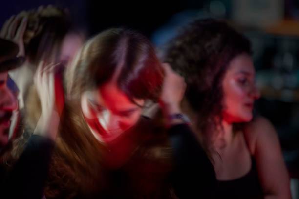 istock Young people having fun in at a concerts 1309823644