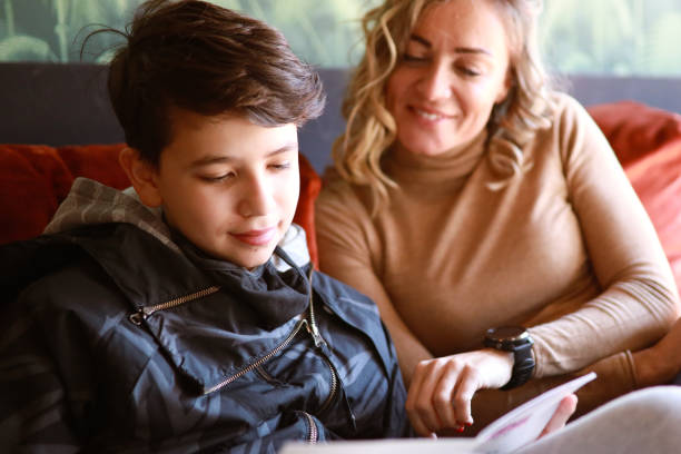 istock Mom sitting with her son in the cafe 1309823877