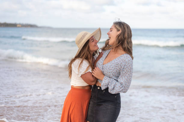 istock Friends laughing together at the beach 1309830695