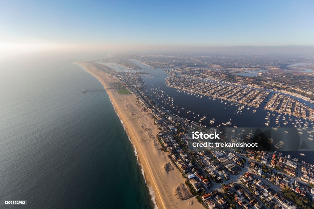 Newport Beach with Afternoon Pacific Fog Aerial Aerial view of Newport Beach bay and harbor with afternoon pacific ocean fog rolling in. California Stock Photo