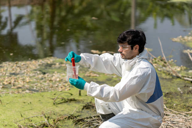 istock A man in full body protective suit collecting samples of water 1309833975