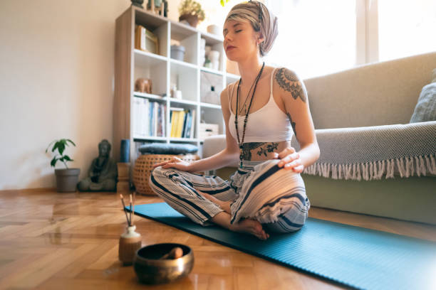 istock Young woman relaxing and meditating 1309834990
